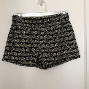 Black and beige elephant pattern shorts